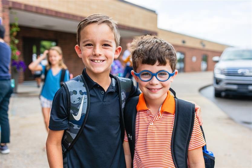 Two boys smile